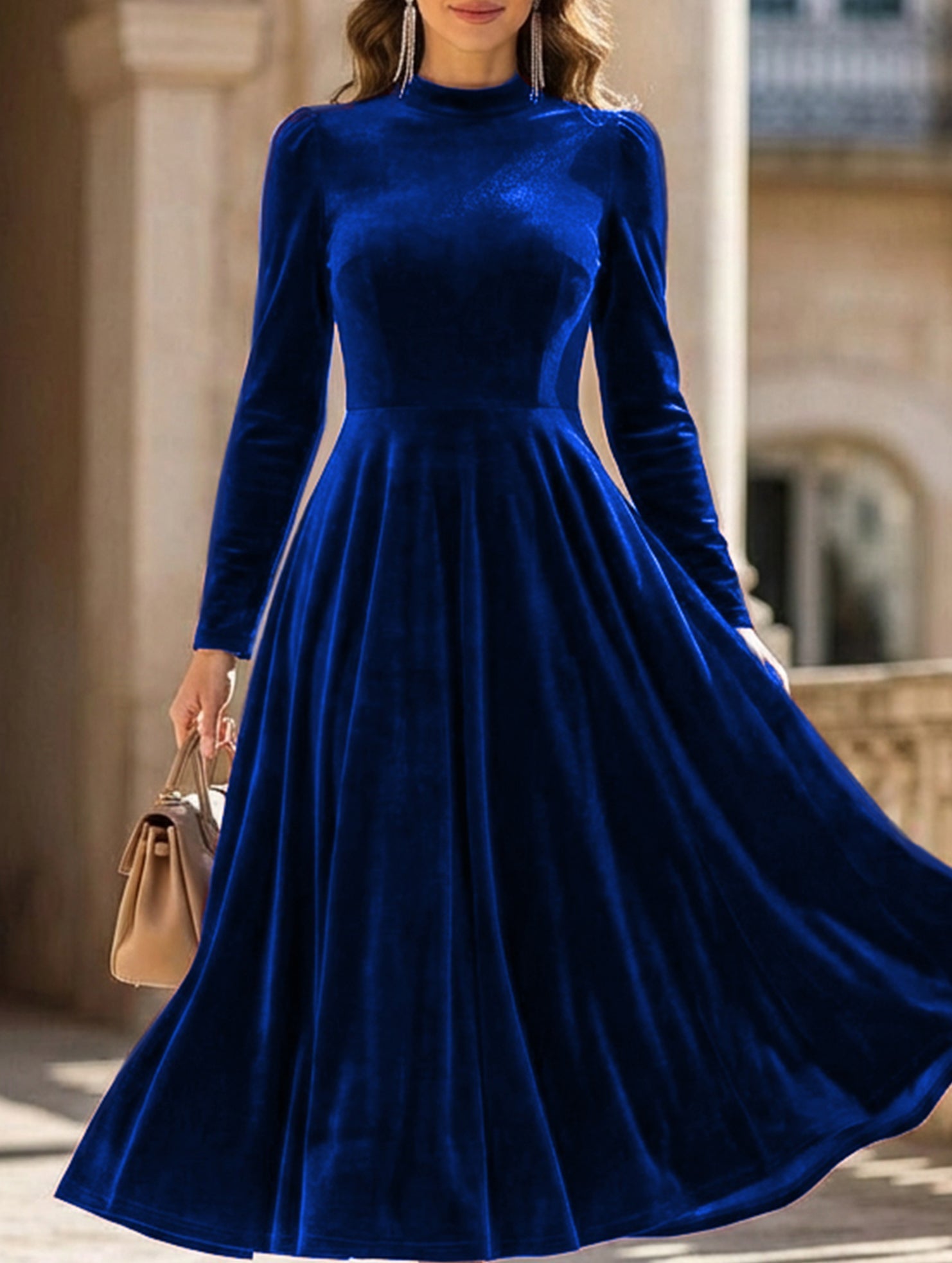 Blue velvet round neck long-sleeved dress by Tammy Bradley, featuring a stylish and elegant design.