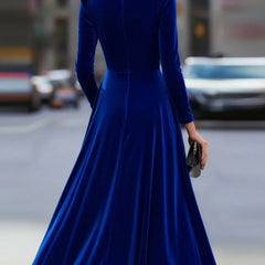 Blue velvet round neck long-sleeved dress by Tammy Bradley, stylish and elegant, shown on a model.