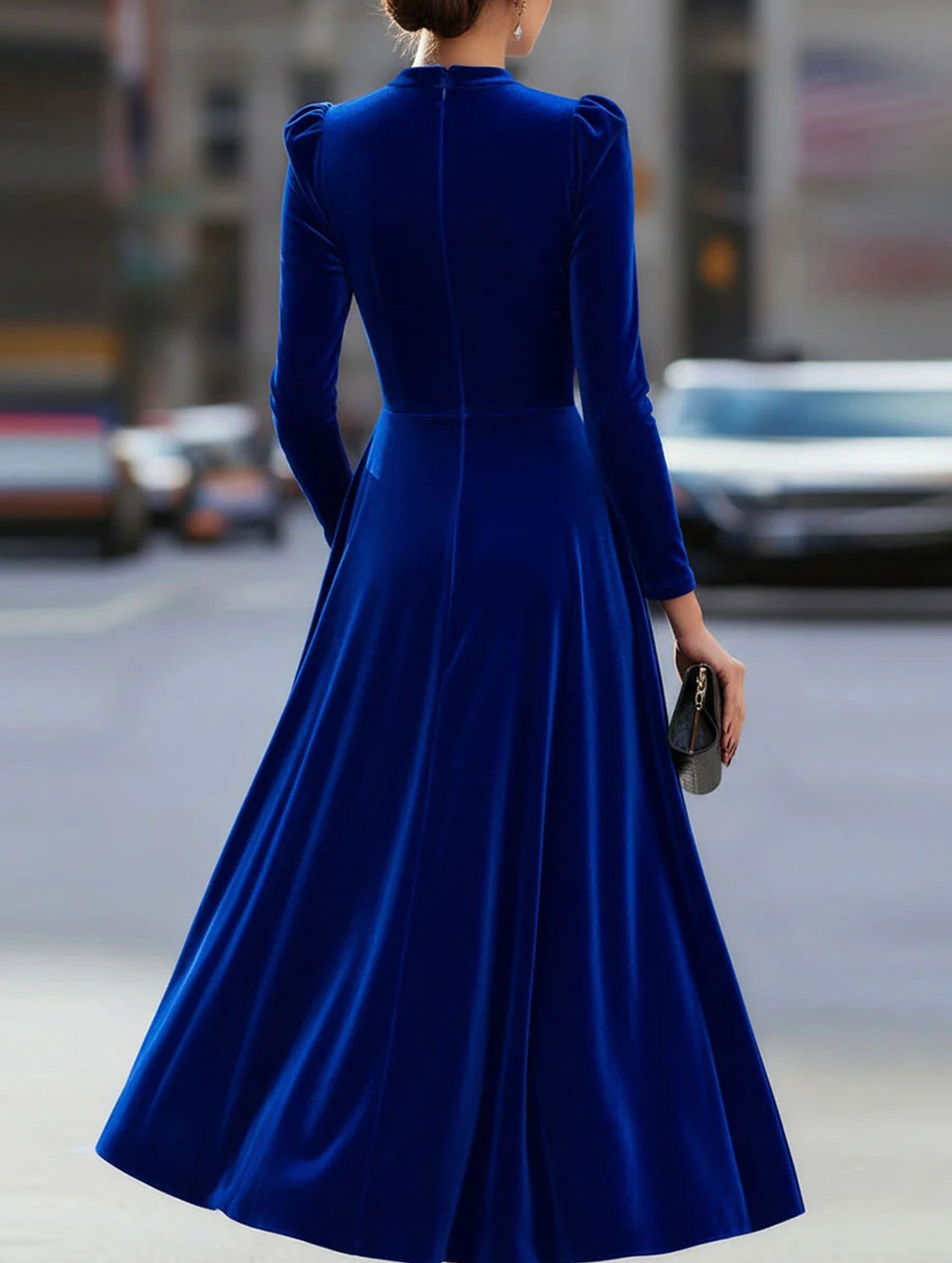 Blue velvet round neck long-sleeved dress by Tammy Bradley, stylish and elegant, shown on a model.