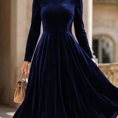 White velvet round neck long-sleeved dress by Tammy Bradley, showcasing a stylish and elegant dress with a smooth fabric finish.
