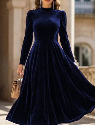White velvet round neck long-sleeved dress by Tammy Bradley, showcasing a stylish and elegant dress with a smooth fabric finish.