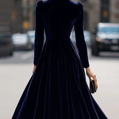 White velvet round neck long-sleeved dress by Tammy Bradley, showcasing a stylish, elegant dress with a smooth velvet texture and classic fit.