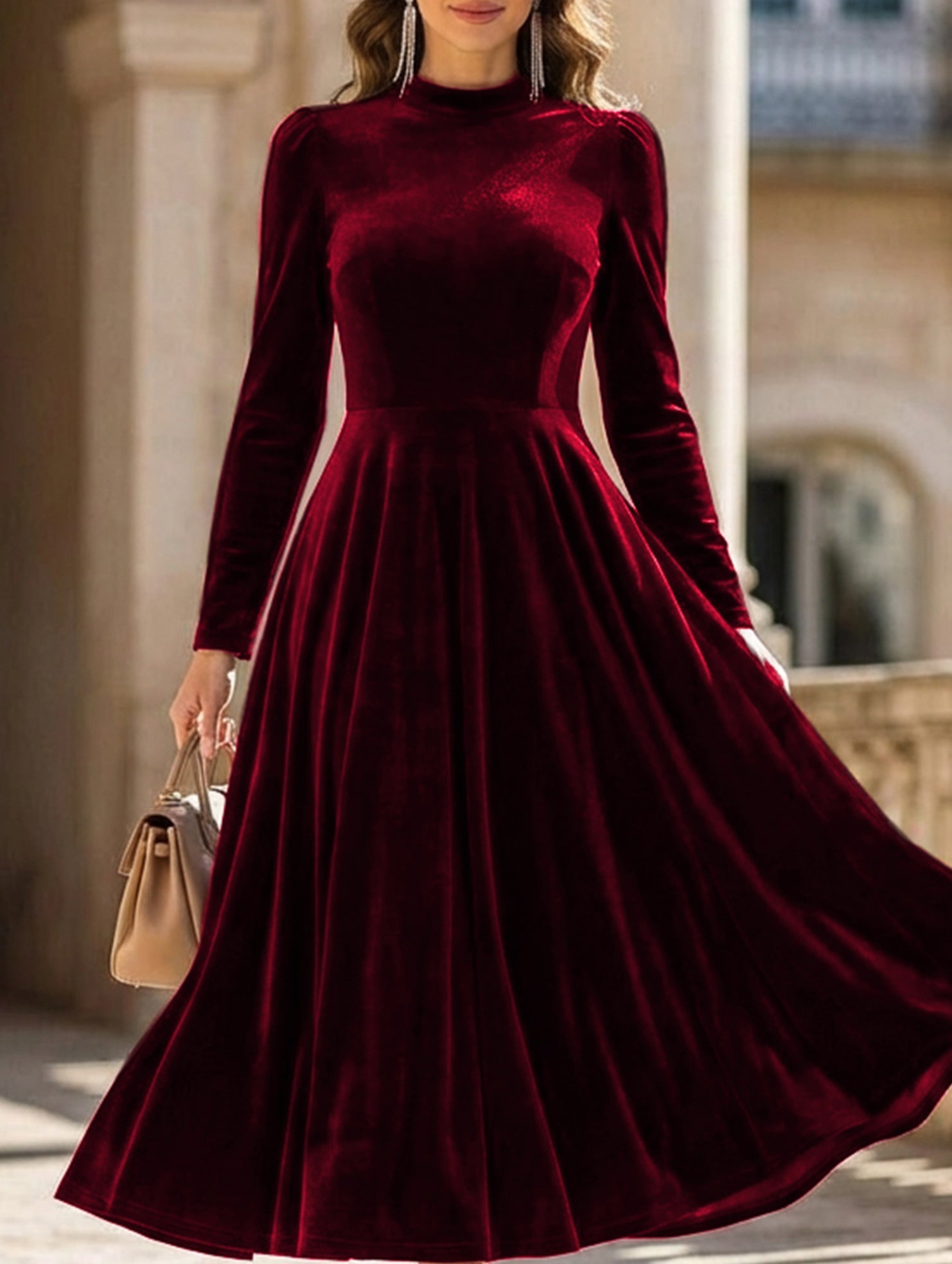 White velvet round neck long-sleeved dress by Tammy Bradley, shown on a model with a fitted silhouette and elegant design.