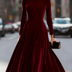 White velvet round neck long-sleeved dress by Tammy Bradley, shown in a stylish close-up view highlighting the fabric and neckline.