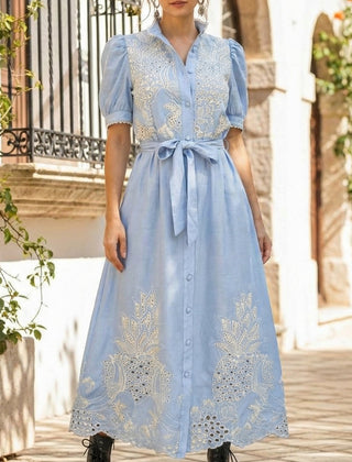 White pastoral style openwork embroidered dress with delicate detailing, perfect for elegant occasions.