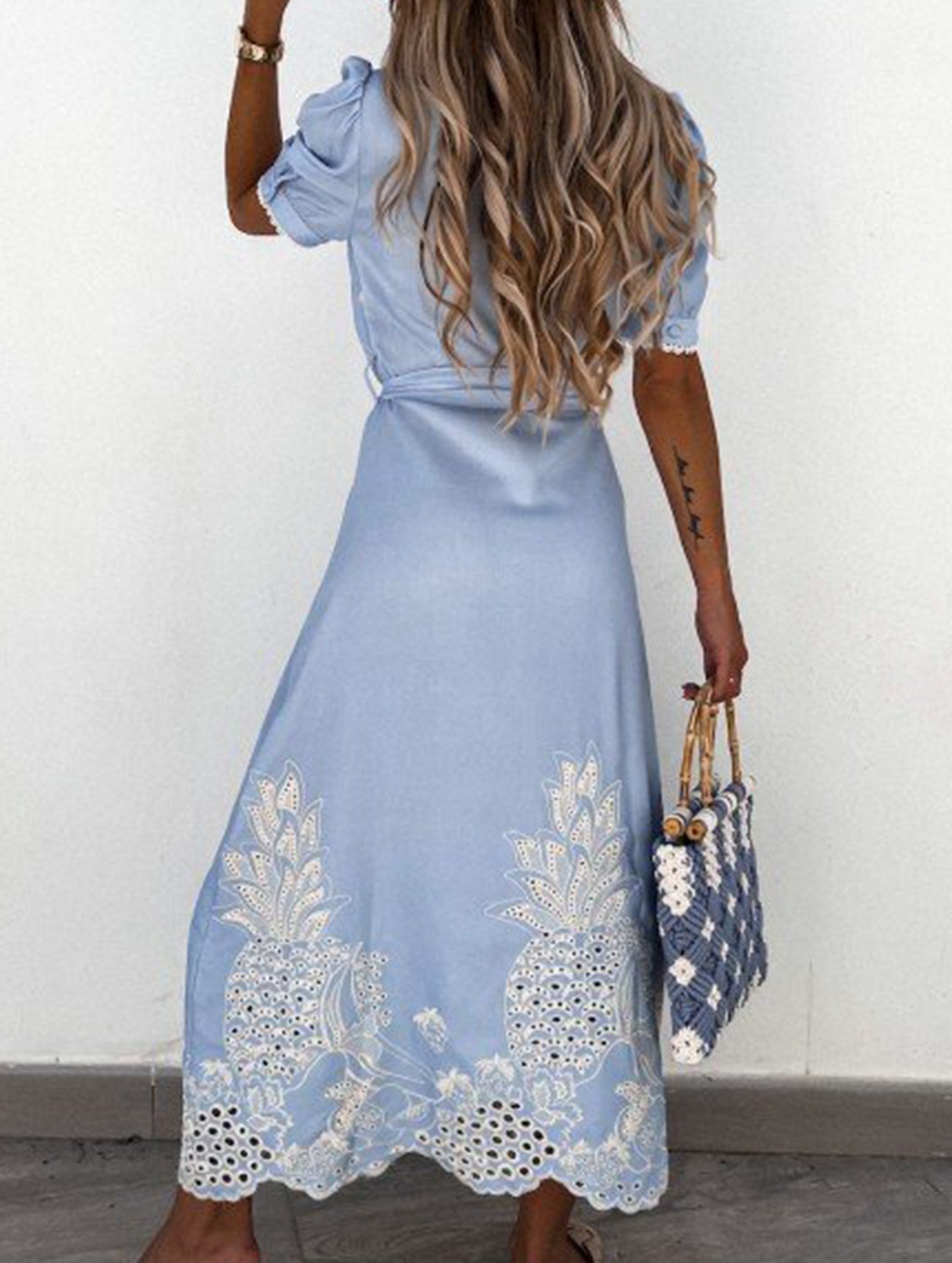 White pastoral style openwork embroidered dress with delicate detailing, perfect for elegant occasions.