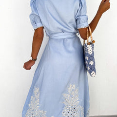 White pastoral style embroidered openwork dress with floral details, featuring a relaxed fit and delicate embroidery.