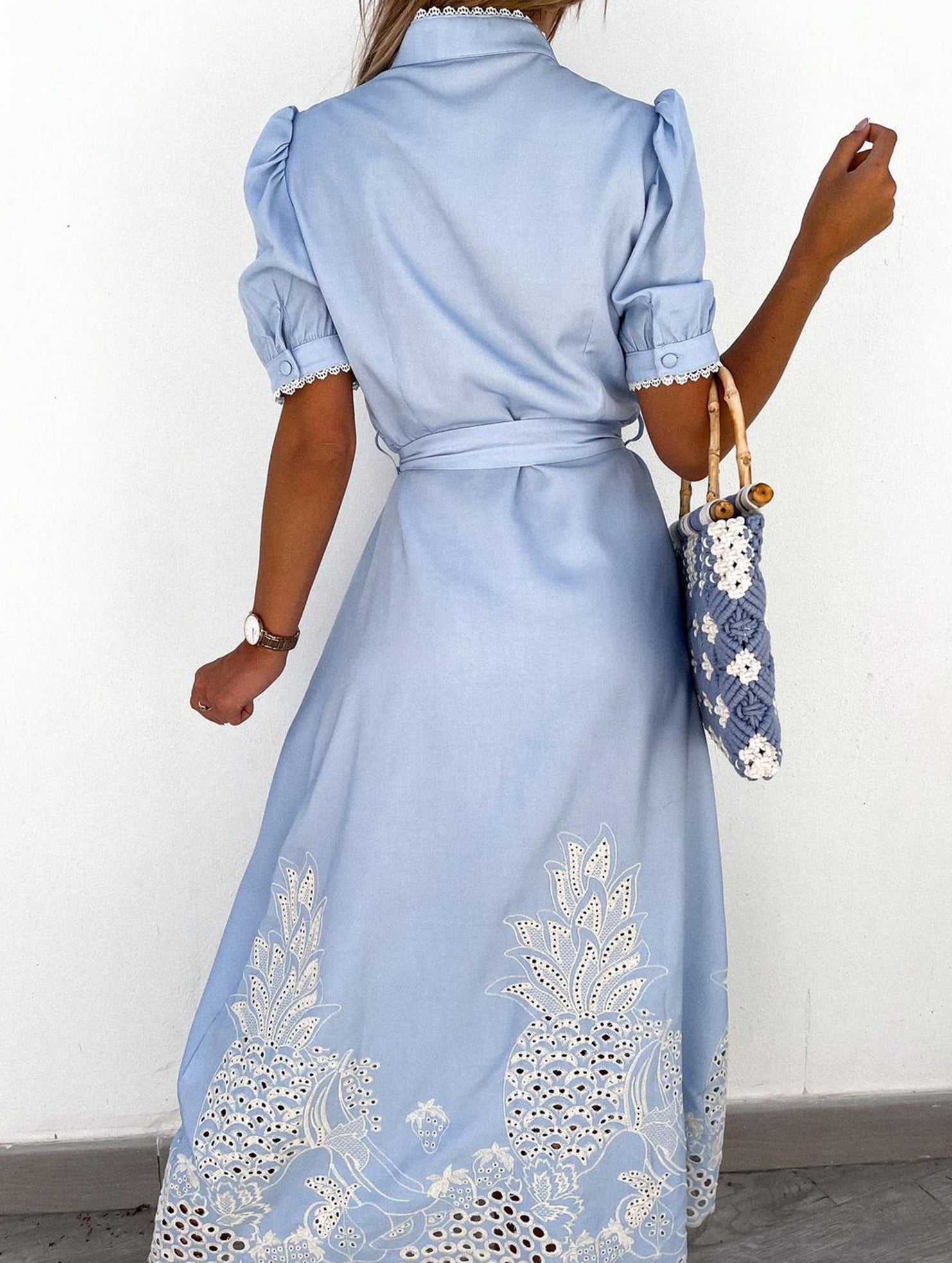 White pastoral style embroidered openwork dress with floral details, featuring a relaxed fit and delicate embroidery.