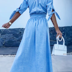 Blue deep V-neck fitted shirt dress, stylish and elegant, showcasing the tailored design and sleek silhouette.