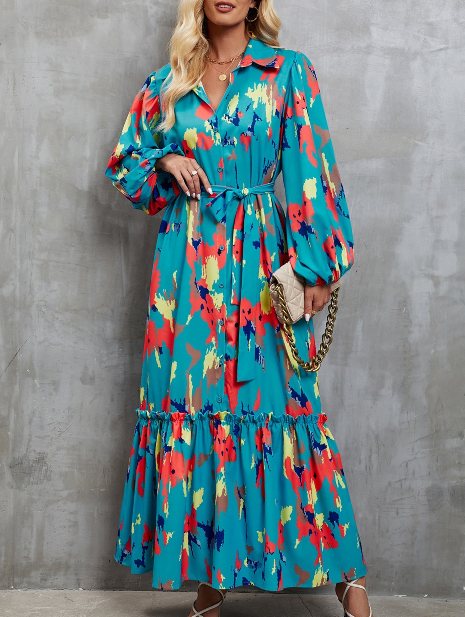 Blue printed tie-waist lantern sleeve dress with a white background, showcasing a stylish and flowy design.
