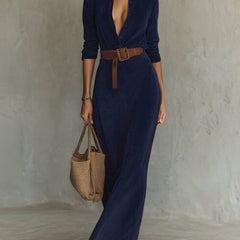 Navy suede long dress with a fitted waist and belt, featuring a sleek, elegant silhouette and classic style.