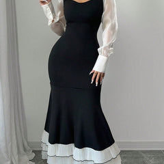 Colorblock long sleeve mermaid dress in black and white, featuring a fitted silhouette and elegant design by My Store.