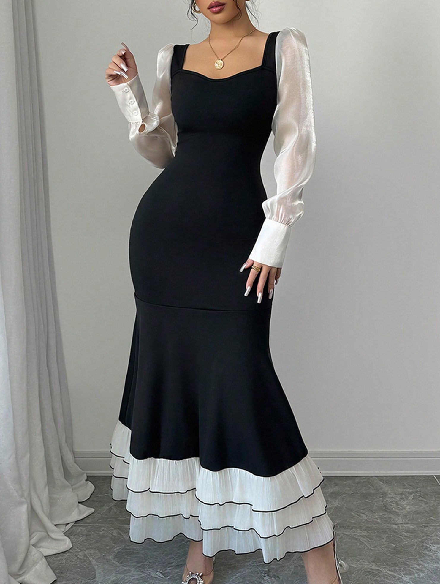Colorblock long sleeve mermaid dress in black and white, featuring a fitted silhouette and elegant design by My Store.