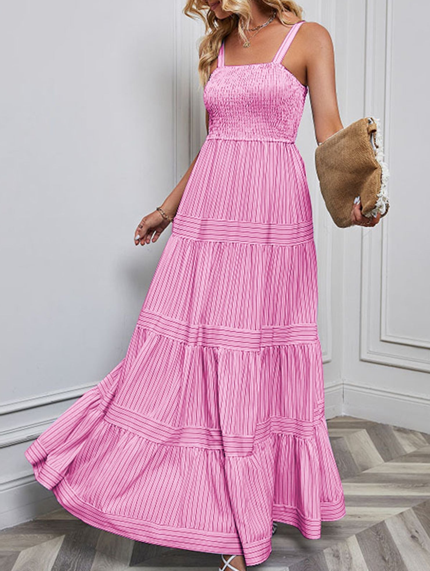Pink retro striped maxi dress with a fitted bodice and flowing skirt, perfect for casual or summer wear.