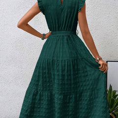 White ruffled flutter sleeve tie textured dress by My Store, shown on a hanger with detailed fabric and stylish design.