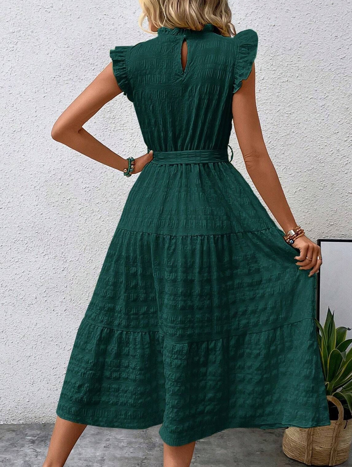 White ruffled flutter sleeve tie textured dress by My Store, shown on a hanger with detailed fabric and stylish design.