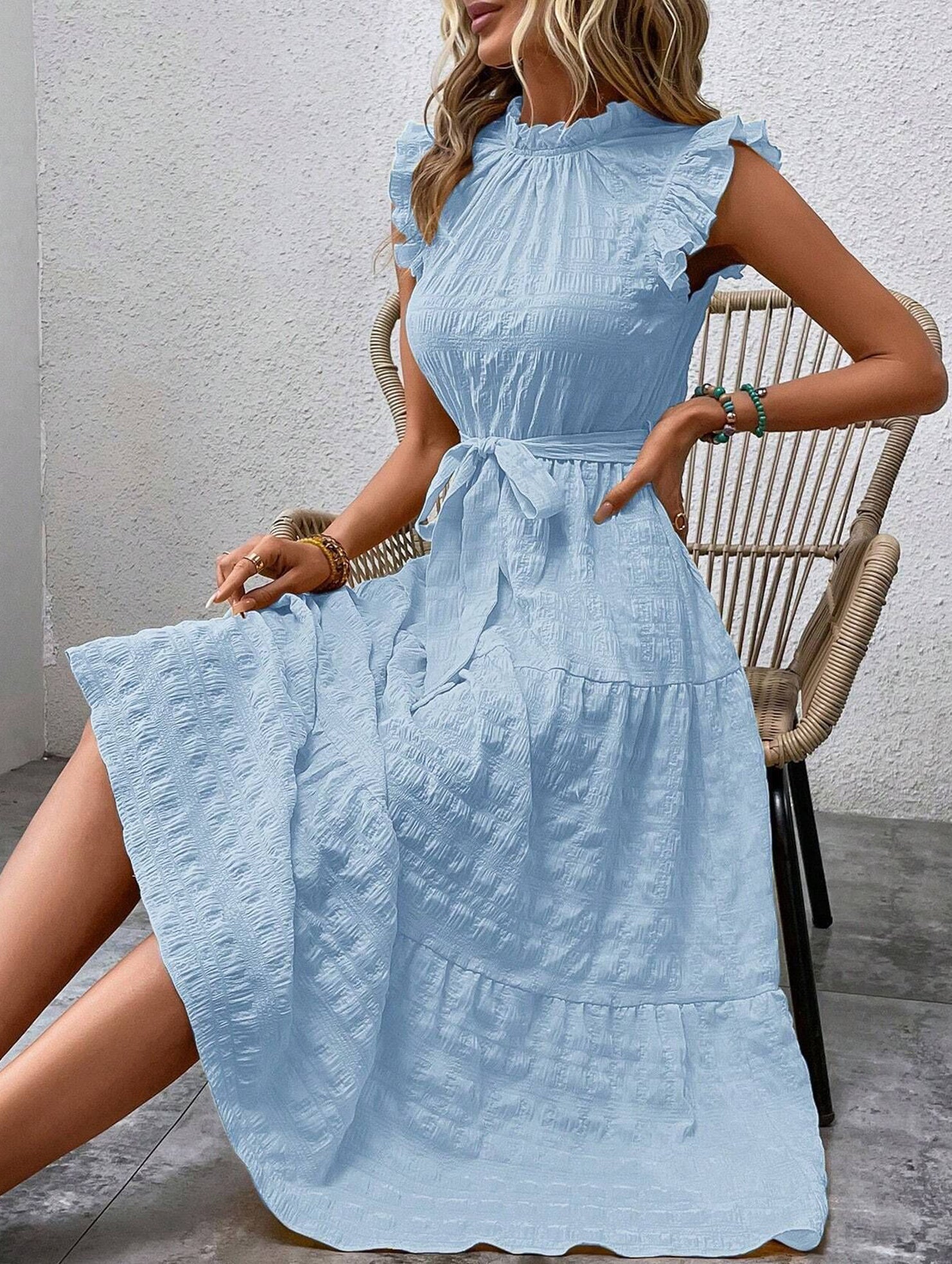 Light blue ruffled flutter sleeve tie textured dress, stylish and comfortable, perfect for casual or semi-formal occasions.