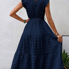 White ruffled flutter sleeve textured dress from My Store, featuring a tie waist and stylish design.