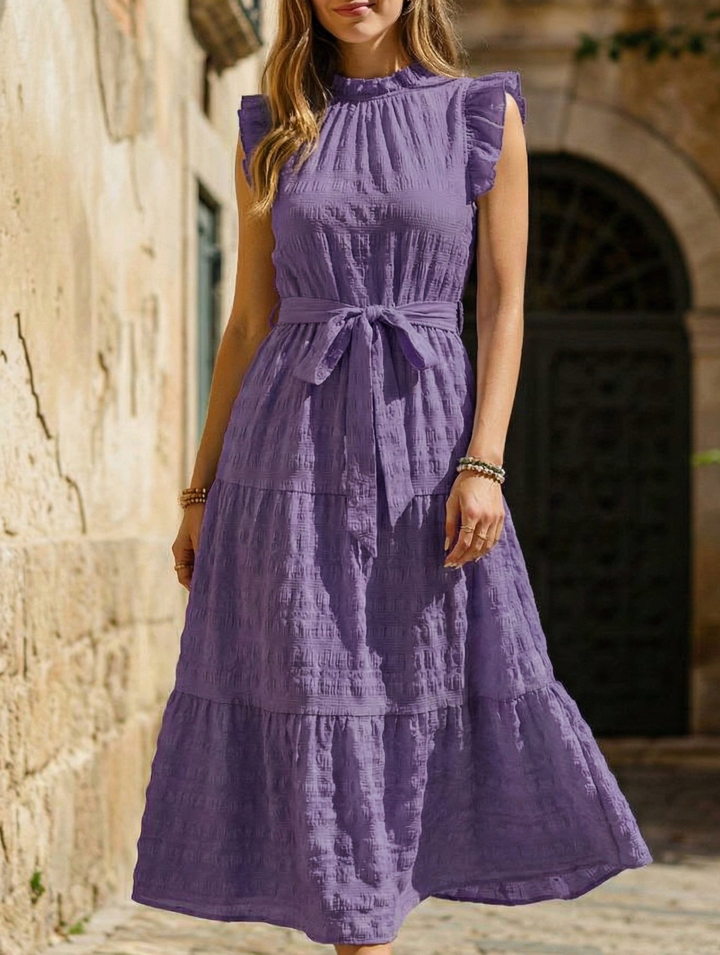 Purple ruffled flutter sleeve tie-textured dress, stylish and elegant, featuring a feminine silhouette and intricate fabric details.