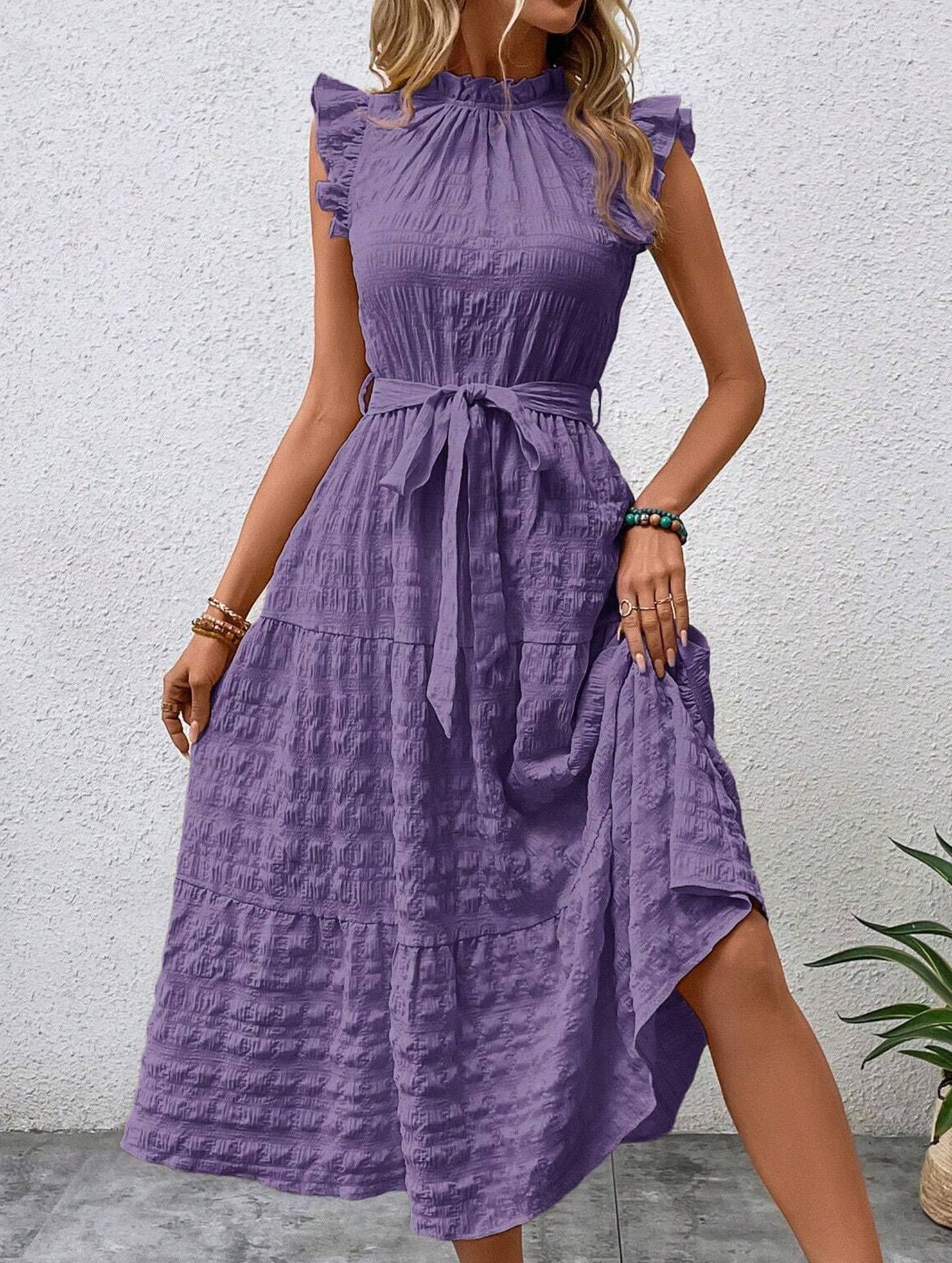 Purple ruffled flutter sleeve tie-textured dress with a feminine silhouette, featuring delicate fabric details and a stylish design.