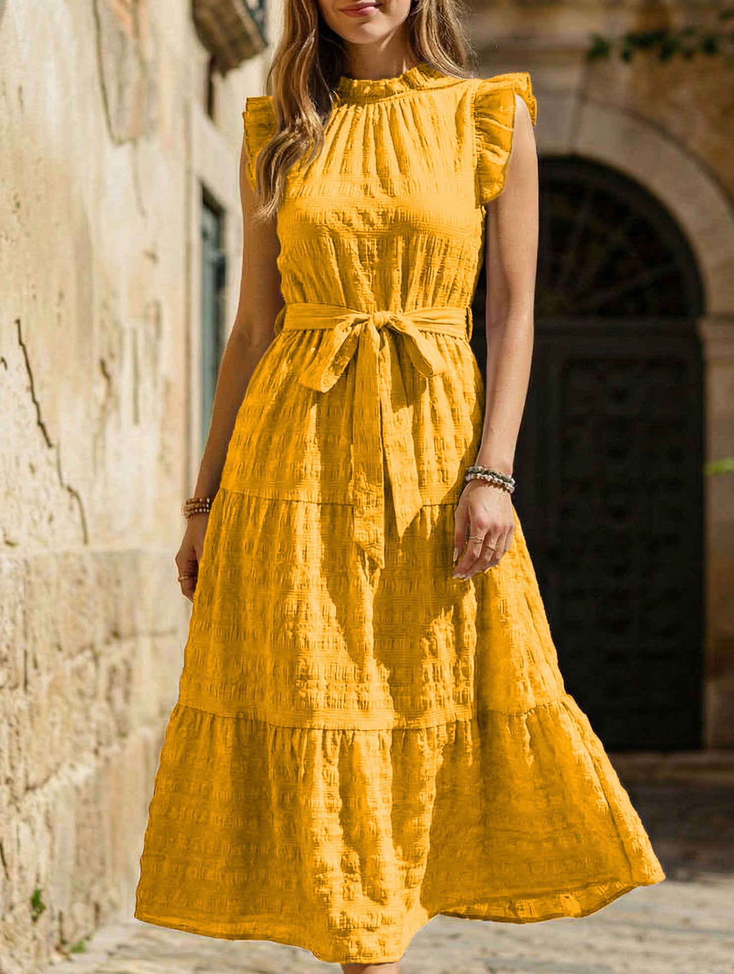 White ruffled flutter sleeve tie textured dress, stylish and feminine, perfect for casual or semi-formal occasions.