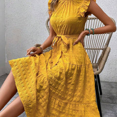 White ruffled flutter sleeve tie dress with textured fabric, stylish and comfortable, perfect for casual or semi-formal wear.