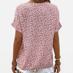 Lightweight women's floral cotton blouse with button front and casual fit, designed for comfortable everyday wear.
