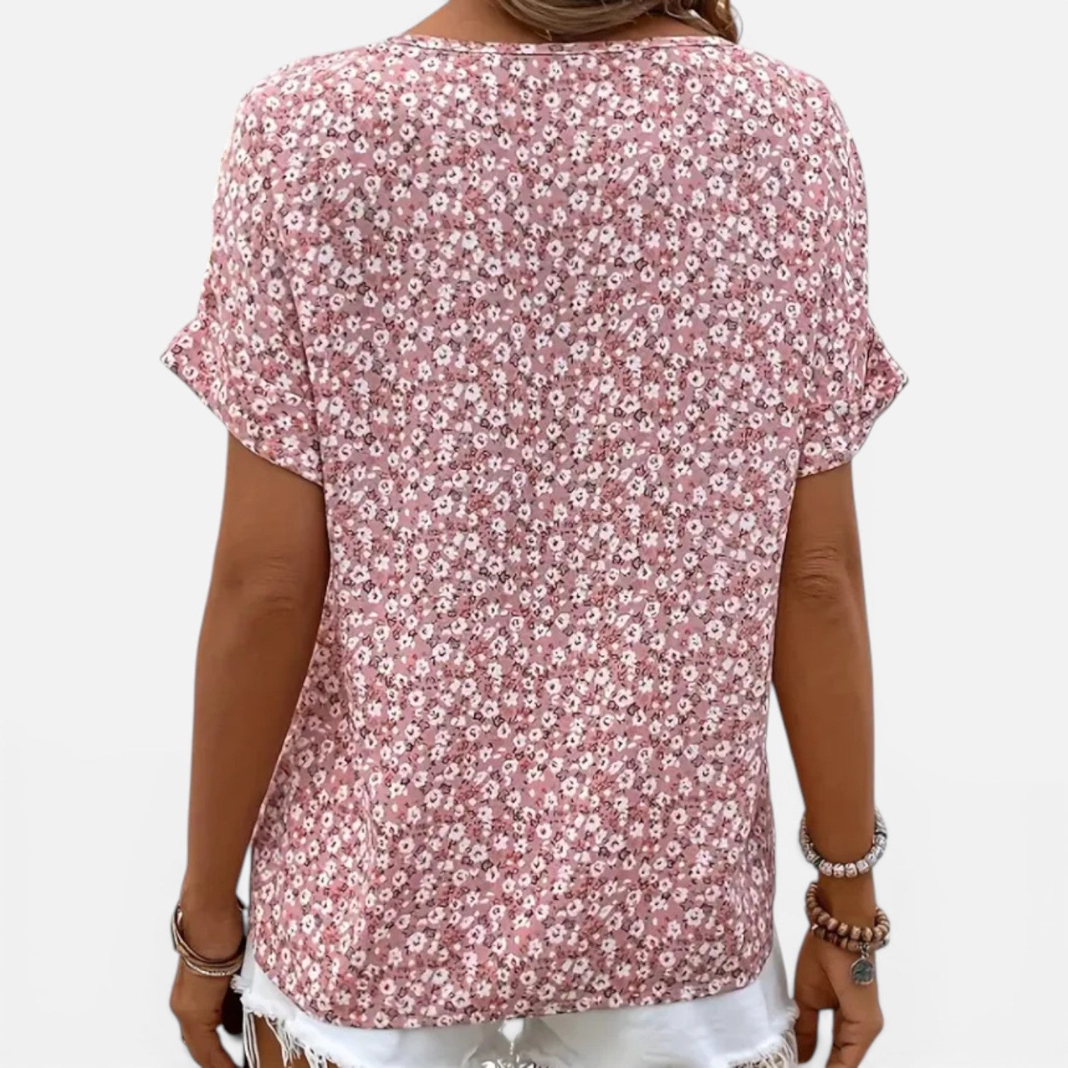 Lightweight women's floral cotton blouse with button front and casual fit, designed for comfortable everyday wear.