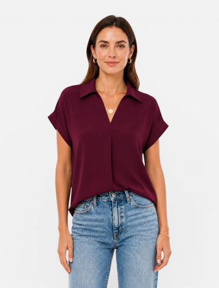 Lightweight women's V-neck short sleeve blouse with relaxed fit, casual style, shown in natural fabric and fit.