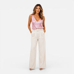 Sequin V-neck women's top for evening wear, featuring shiny sequins and a stylish fit, ideal for party and night-out occasions.