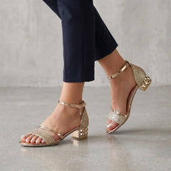 Gold metallic block-heel ankle-strap sandals for women by Tammy Bradley, showcasing stylish design and comfortable fit.