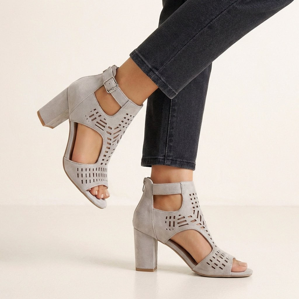Gray women's block-heel sandals with cut-out design and ankle buckle by Tammy Bradley.