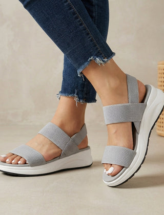 Gray women's orthopedic sandals with adjustable straps and flowy design, providing comfort and support.