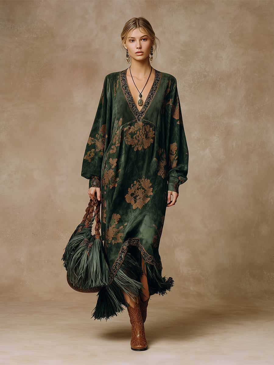 Green faux suede maxi dress for women with tassel details, flowing silhouette, and long sleeves.