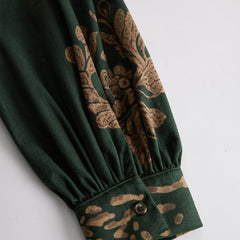 Green faux suede tassel maxi dress for women featuring a flowing silhouette and tassel details.