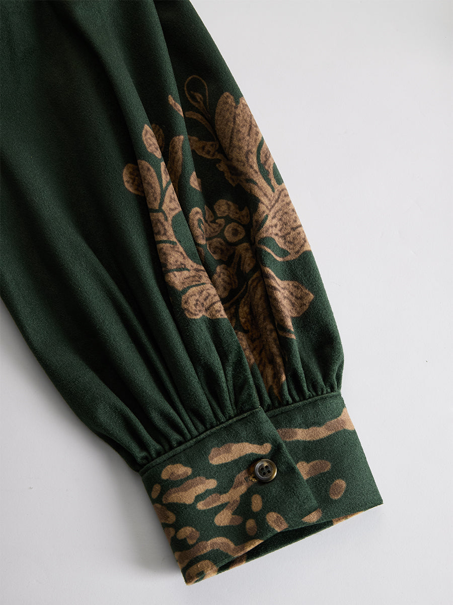 Green faux suede tassel maxi dress for women featuring a flowing silhouette and tassel details.