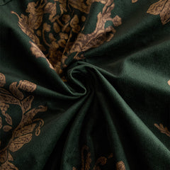 Green faux suede tassel maxi dress for women with flowing design and tassel details, perfect for elegant occasions.