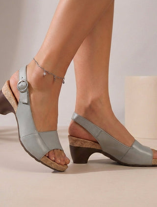 Grey orthopedic heeled sandals for women with wedge heel, adjustable strap, and arch support, ideal for summer comfort.