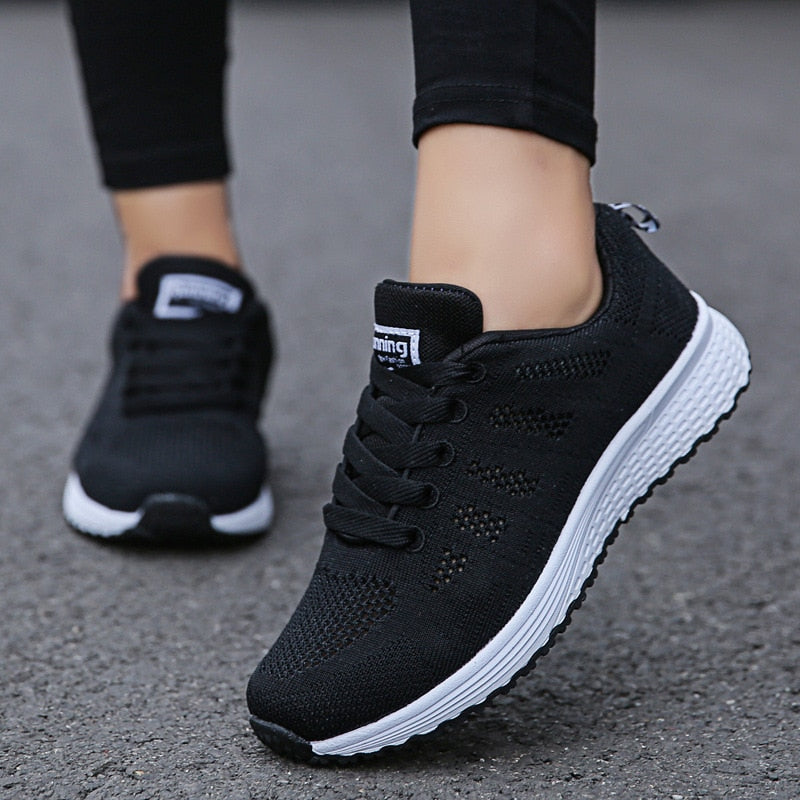 Comfortable women's orthopedic walking shoes with lace-up knit design, ideal for daily support and active walking.