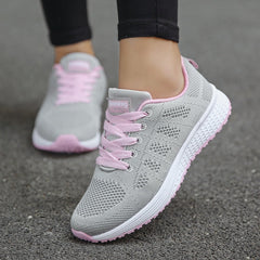 Comfortable women's orthopedic walking shoes with lace-up knit design, providing support and style for daily walking.