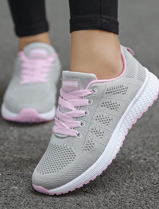 Comfortable women's orthopedic walking shoes with lace-up knit design, providing support and style for daily walking.