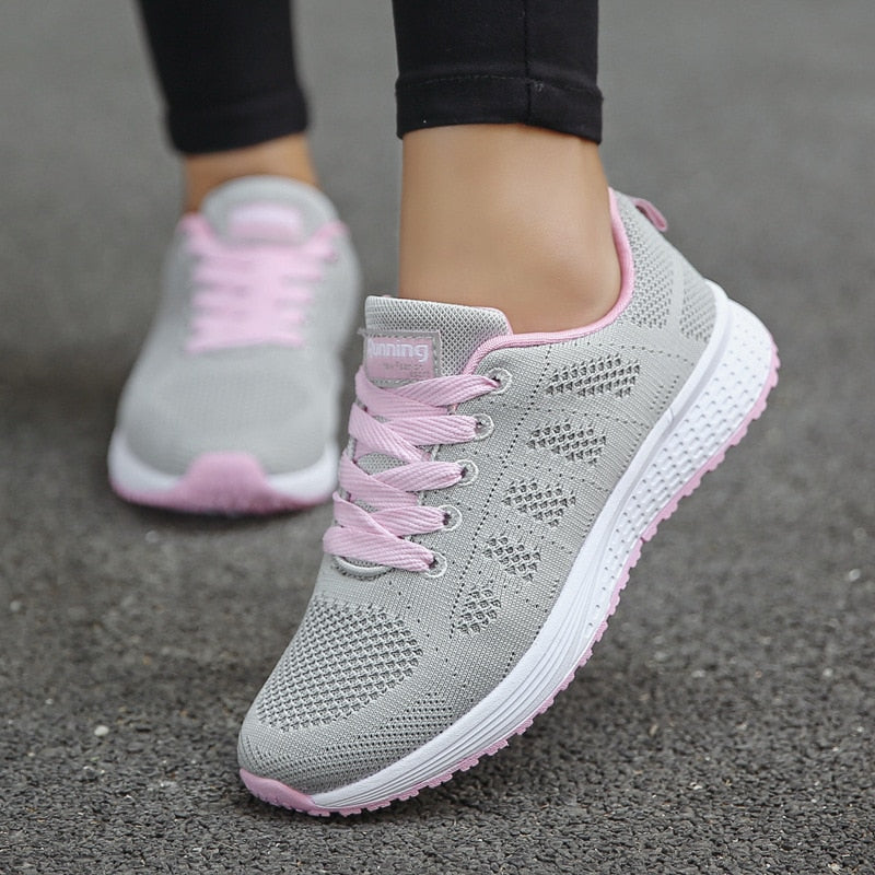 Comfortable women's orthopedic walking shoes with lace-up knit design, providing support and style for daily walking.