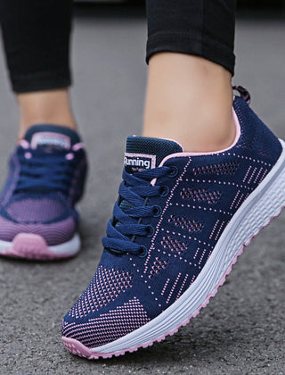 Comfortable women's orthopedic walking shoes with lace-up knit design, offering support and stability for everyday walking.