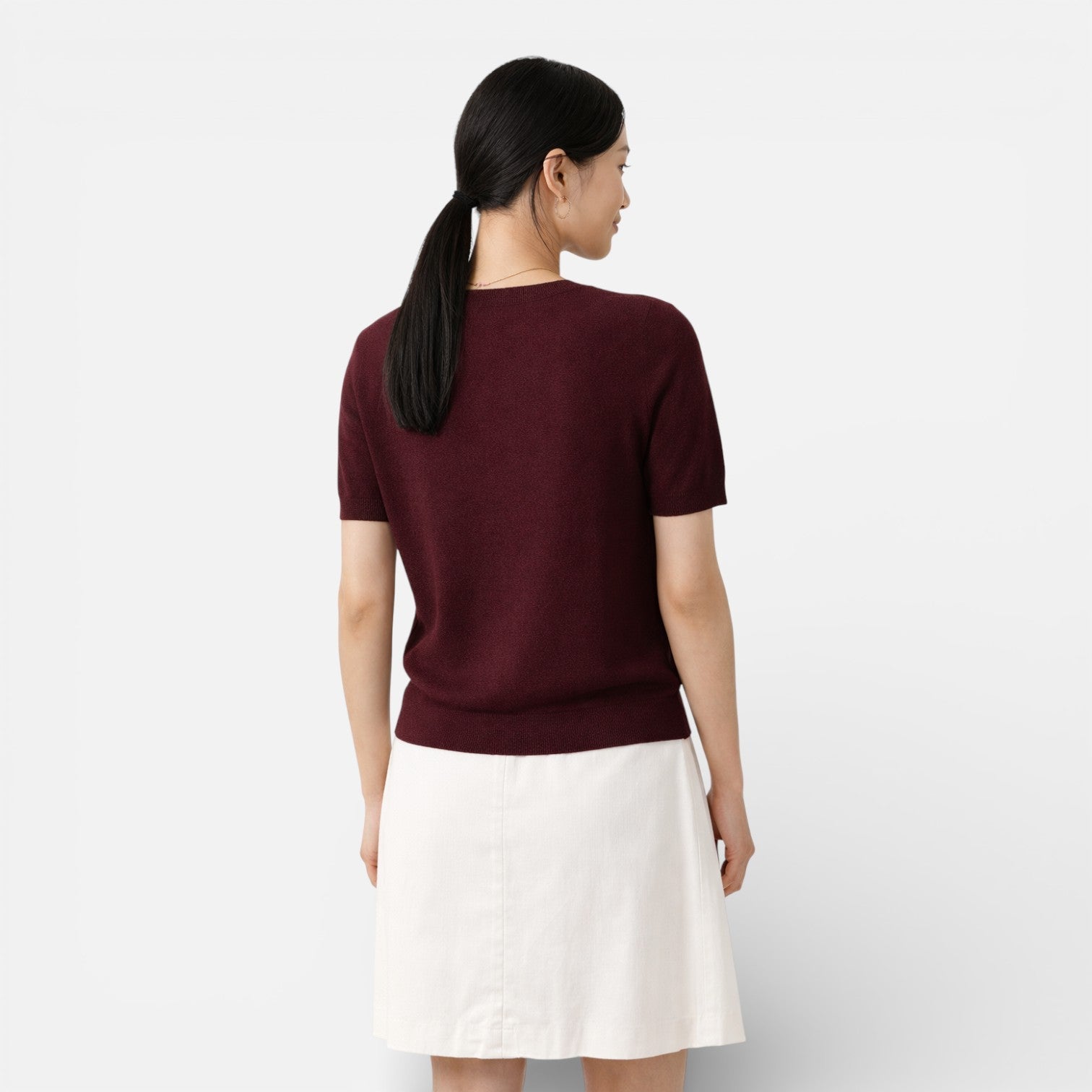 Women's knit top made of wool blend with a comfortable, classic fit, featuring long sleeves and a stylish design.
