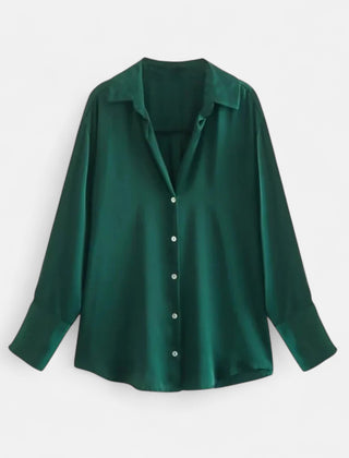 Women's button-front long sleeve blouse with classic fit, shown in a stylish design, perfect for casual or office wear.