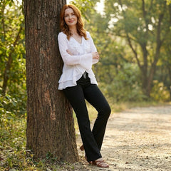 Women’s summer blouse in denim with bell sleeves, stylish casual top for warm weather, featuring a relaxed fit and feminine design.