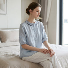 Women's linen ruffle summer blouse, stylish and breathable top perfect for warm weather, featuring feminine ruffle details.