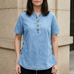 Light blue denim women's summer top with button front, casual sleeveless design, perfect for warm-weather outfits.
