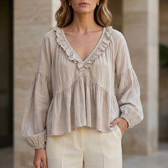 White V-neck long sleeve denim blouse with ruffle details, stylish women's top perfect for summer wear.