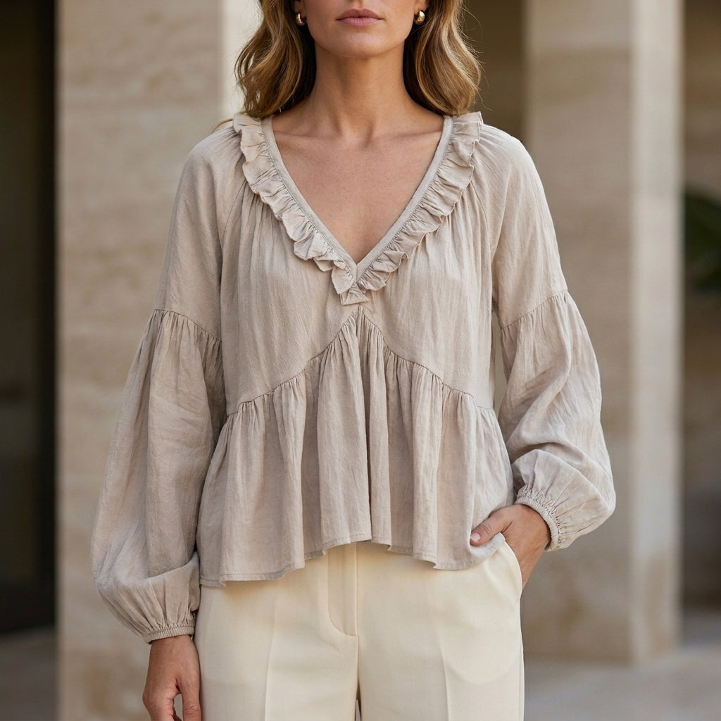 White V-neck long sleeve denim blouse with ruffle details, stylish women's top perfect for summer wear.